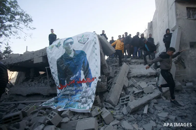 People gather amidst debris after Israeli forces demolished the home of a Palestinian accused of killing an Israeli soldier, in the village of Hares, in the West Bank, on May 3, 2023. The Israeli forces, accompanied by 5...