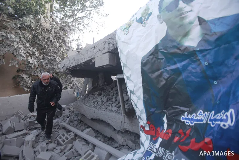 People gather amidst debris after Israeli forces demolished the home of a Palestinian accused of killing an Israeli soldier, in the village of Hares, in the West Bank, on May 3, 2023. The Israeli forces, accompanied by 5...