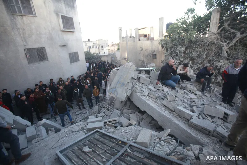 People gather amidst debris after Israeli forces demolished the home of a Palestinian accused of killing an Israeli soldier, in the village of Hares, in the West Bank, on May 3, 2023. The Israeli forces, accompanied by 5...