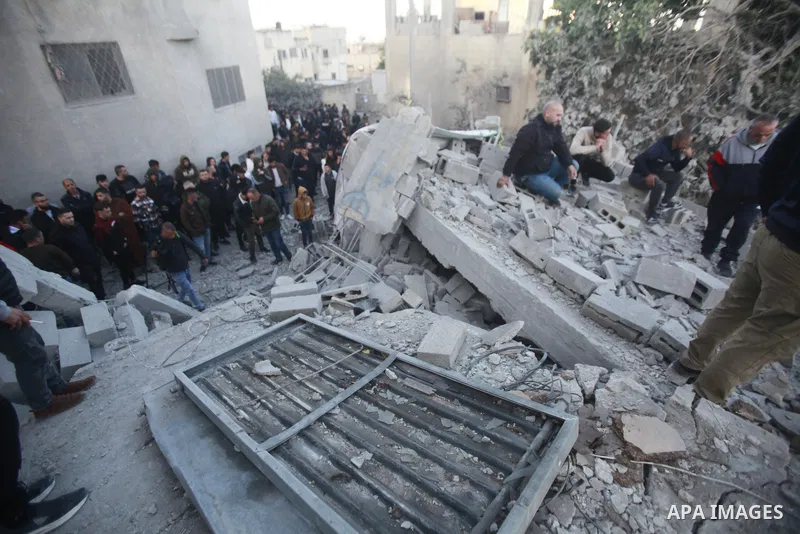 People gather amidst debris after Israeli forces demolished the home of a Palestinian accused of killing an Israeli soldier, in the village of Hares, in the West Bank, on May 3, 2023. The Israeli forces, accompanied by 5...