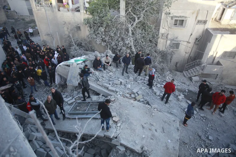 People gather amidst debris after Israeli forces demolished the home of a Palestinian accused of killing an Israeli soldier, in the village of Hares, in the West Bank, on May 3, 2023. The Israeli forces, accompanied by 5...