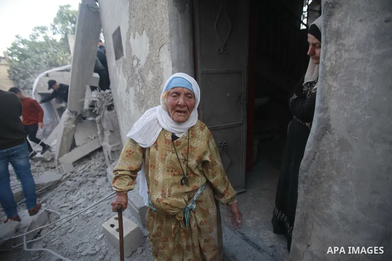 People gather amidst debris after Israeli forces demolished the home of a Palestinian accused of killing an Israeli soldier, in the village of Hares, in the West Bank, on May 3, 2023. The Israeli forces, accompanied by 5...