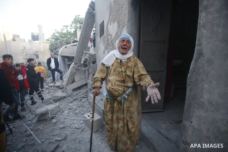 People gather amidst debris after Israeli forces demolished the home of a Palestinian accused of killing an Israeli soldier, in the village of Hares, in the West Bank, on May 3, 2023. The Israeli forces, accompanied by 5...