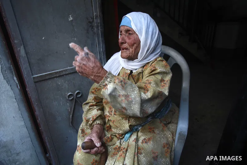 People gather amidst debris after Israeli forces demolished the home of a Palestinian accused of killing an Israeli soldier, in the village of Hares, in the West Bank, on May 3, 2023. The Israeli forces, accompanied by 5...