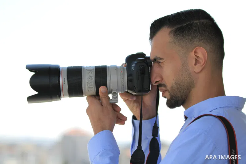 A Palestinian journalist photographer Moutasem brother of Journalist Yasser Murtaja's who was shot killed by Israeli forces during protests at the Gaza-Israel border on 2018, works at his office during World Press Freedo...