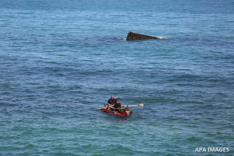 Palestinian fishermen work on the shore of the Mediterranean Sea in Gaza city May 4, 2023. Photo by Bashar Taleb\ apaimages