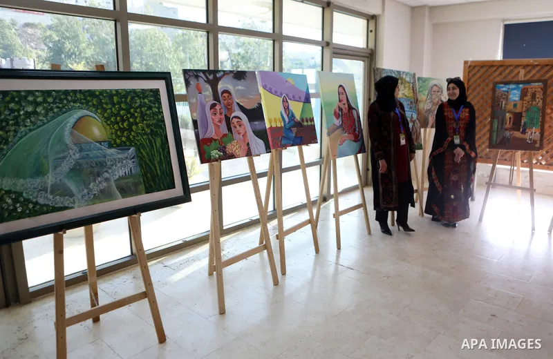 Palestinians attend an exhibition "Lammat al-Khalil" in the West Bank city of Hebron on May 6, 2023. Photo by Mamoun Wazwaz