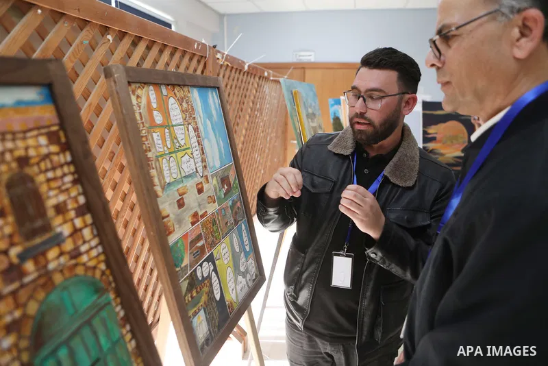 Palestinians attend an exhibition "Lammat al-Khalil" in the West Bank city of Hebron on May 6, 2023. Photo by Mamoun Wazwaz