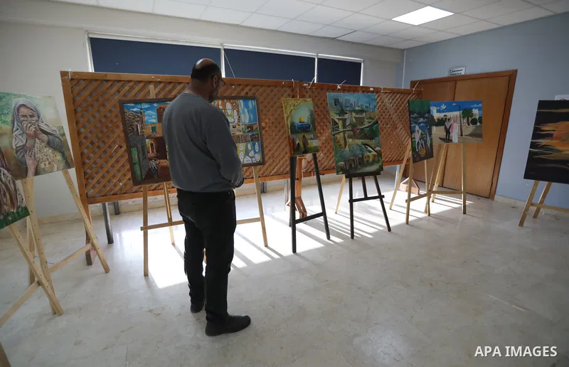Palestinians attend an exhibition "Lammat al-Khalil" in the West Bank city of Hebron on May 6, 2023. Photo by Mamoun Wazwaz