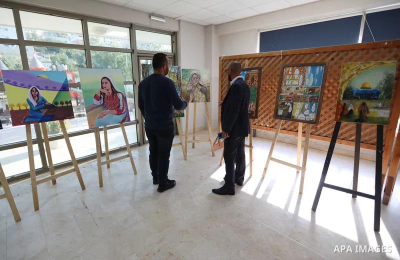 Palestinians attend an exhibition "Lammat al-Khalil" in the West Bank city of Hebron on May 6, 2023. Photo by Mamoun Wazwaz