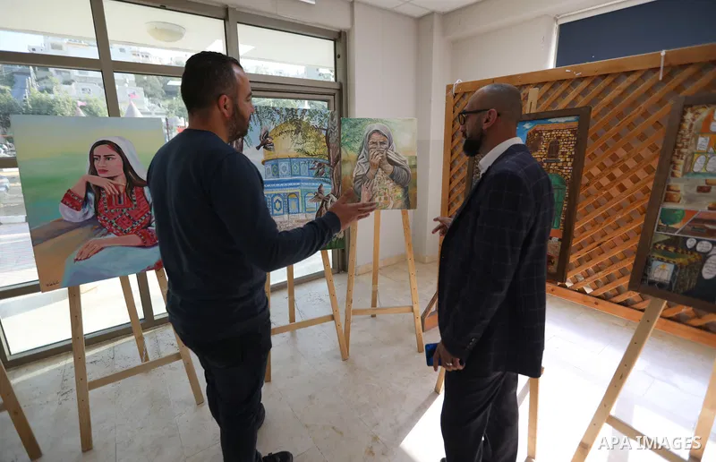 Palestinians attend an exhibition "Lammat al-Khalil" in the West Bank city of Hebron on May 6, 2023. Photo by Mamoun Wazwaz
