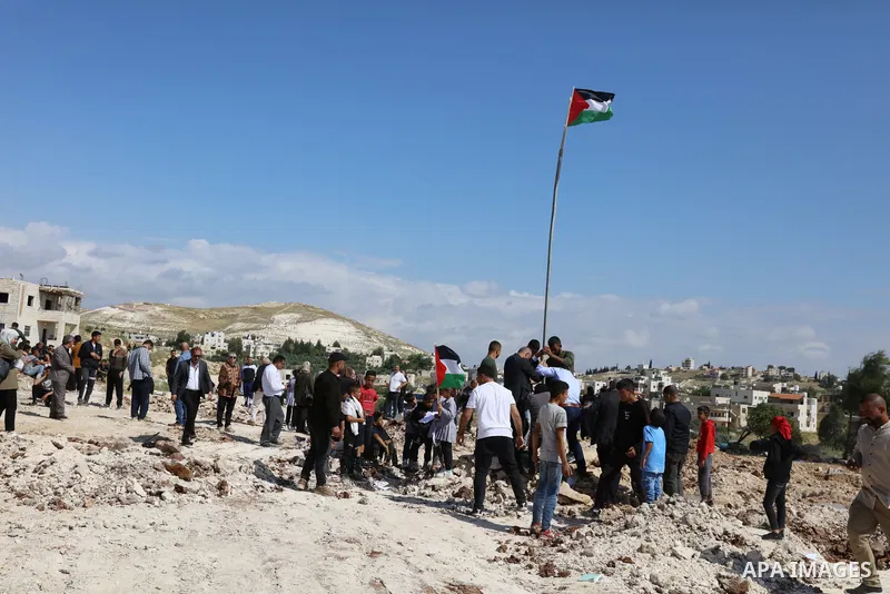 Palestinians gather near the damage of Jibb Al-Deeb School demolished by Israeli authorities in the small Palestinian village of Bayt Ta’mar, to the east of Bethlehem in the south of the West Bank on May 7, 2023. Israeli...
