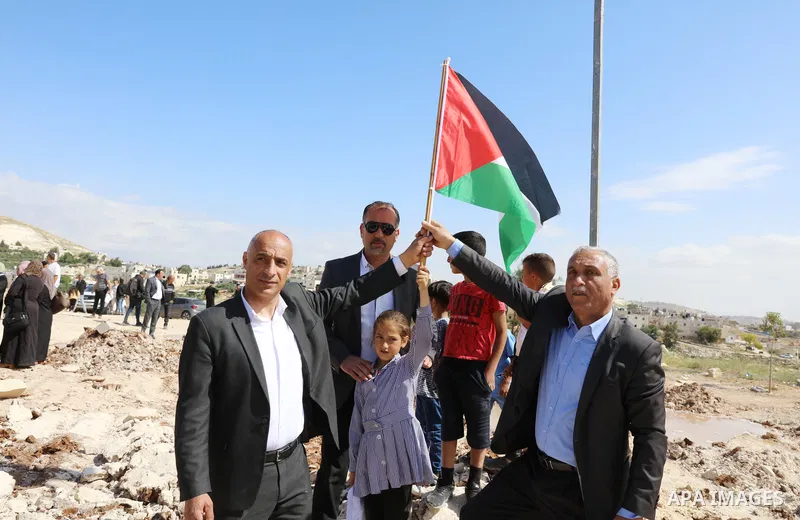 Palestinians gather near the damage of Jibb Al-Deeb School demolished by Israeli authorities in the small Palestinian village of Bayt Ta’mar, to the east of Bethlehem in the south of the West Bank on May 7, 2023. Israeli...