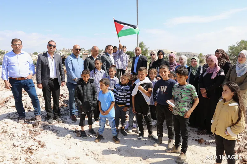 Palestinians gather near the damage of Jibb Al-Deeb School demolished by Israeli authorities in the small Palestinian village of Bayt Ta’mar, to the east of Bethlehem in the south of the West Bank on May 7, 2023. Israeli...