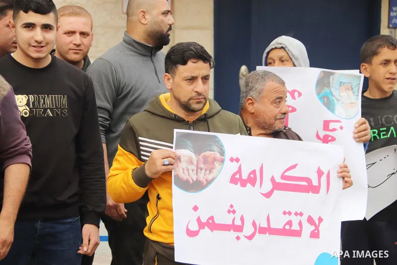 Palestinians of WFP beneficiaries take part in a protest against the stopping of aid, in front of UNSCO office in Gaza city on May 7, 2023. WFP pauses food distribution in Gaza following ‘significant diversion’ of aid. P...