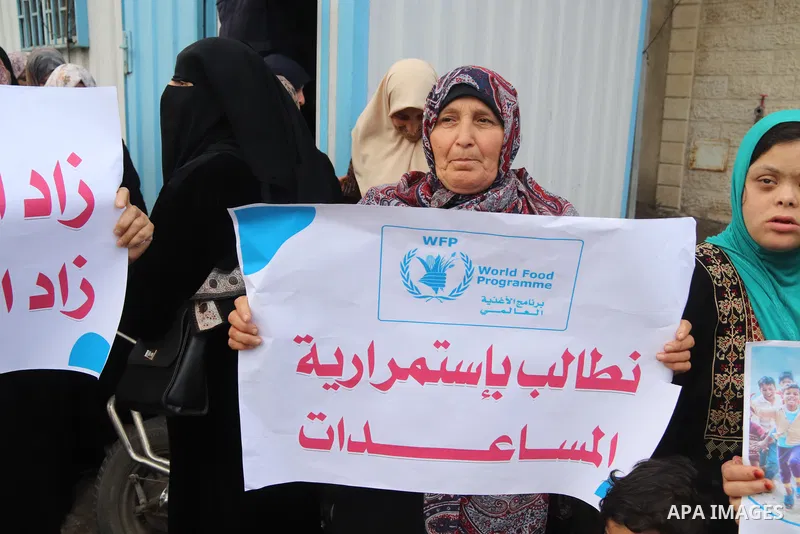 Palestinians of WFP beneficiaries take part in a protest against the stopping of aid, in front of UNSCO office in Gaza city on May 7, 2023. WFP pauses food distribution in Gaza following ‘significant diversion’ of aid. P...