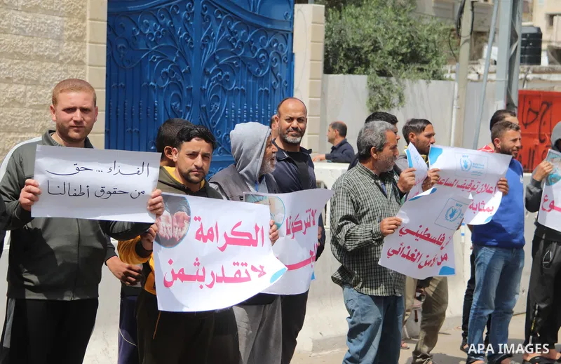 Palestinians of WFP beneficiaries take part in a protest against the stopping of aid, in front of UNSCO office in Gaza city on May 7, 2023. WFP pauses food distribution in Gaza following ‘significant diversion’ of aid. P...