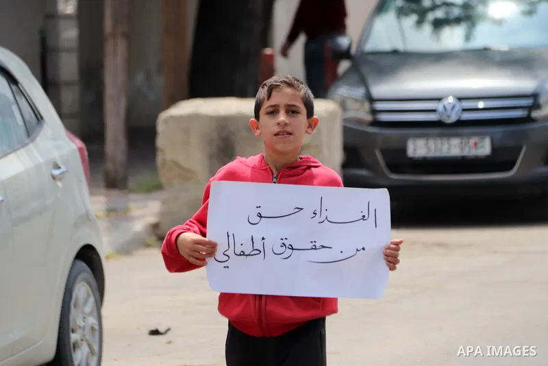 Palestinians of WFP beneficiaries take part in a protest against the stopping of aid, in front of UNSCO office in Gaza city on May 7, 2023. WFP pauses food distribution in Gaza following ‘significant diversion’ of aid. P...