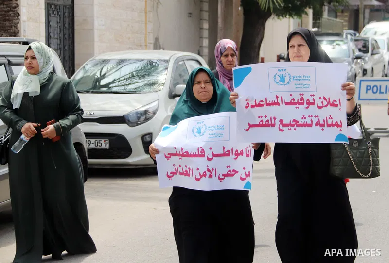 Palestinians of WFP beneficiaries take part in a protest against the stopping of aid, in front of UNSCO office in Gaza city on May 7, 2023. WFP pauses food distribution in Gaza following ‘significant diversion’ of aid. P...