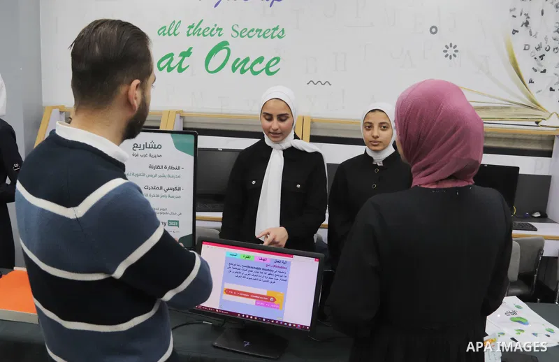 Palestinian students attend an exhibition of their projects at the University College of Applied Sciences in Gaza City on May 7, 2023. Photo by Hashem Zimmo \ apaimages