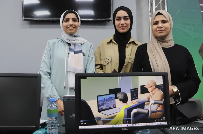 Palestinian students attend an exhibition of their projects at the University College of Applied Sciences in Gaza City on May 7, 2023. Photo by Hashem Zimmo \ apaimages