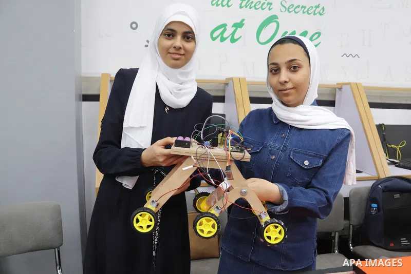 Palestinian students attend an exhibition of their projects at the University College of Applied Sciences in Gaza City on May 7, 2023. Photo by Hashem Zimmo \ apaimages