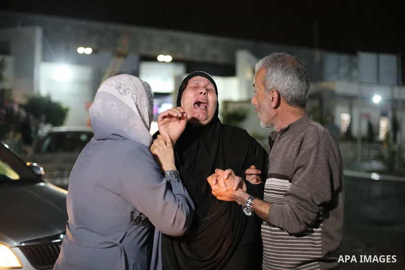 Mother of Palestinian Khalil Al-Bahtini who was killed during Israeli warplanes airstrikes mourns at the mortuary of the Sifa Hospital in Gaza City, on May 09, 2023. Photo by Bashar Taleb \ apaimages