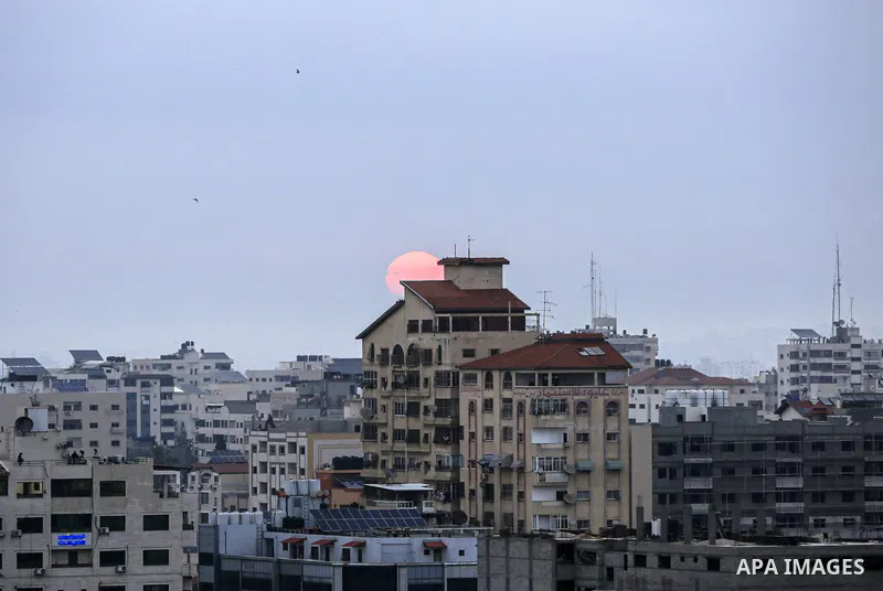 A general view shows the Gaza city during a Sunrise after an Israeli airstrike on May 9, 2023. At least 13 Palestinians, including children and women, were killed early this morning and many others injured in a series of...