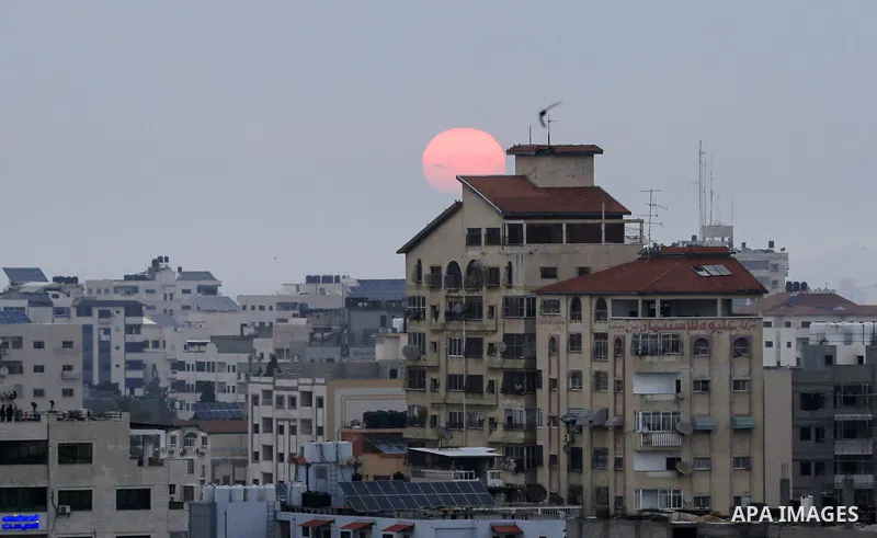 A general view shows the Gaza city during a Sunrise after an Israeli airstrike on May 9, 2023. At least 13 Palestinians, including children and women, were killed early this morning and many others injured in a series of...