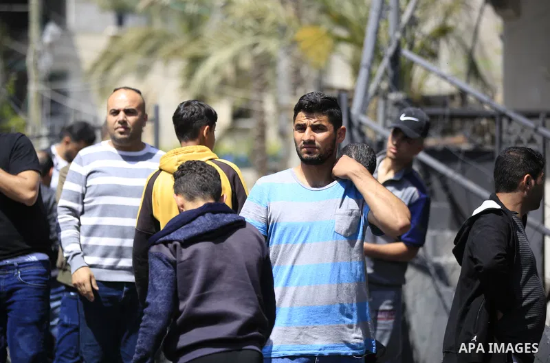 Palestinians inspect the damaged building in the aftermath of Israeli warplanes airstrikes in Beit Lahia in the northern of Gaza Strip on May 11, 2023. Israel and Gaza militants traded cross-border fire, renewing deadly...