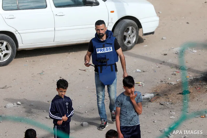 Palestinian journalists cover the conflict between Islamic Jihad movement and Israel in Gaza city on May 2023. Calm returned to Gaza as a fragile ceasefire ending five days of fighting held, leaving Palestinians and Isra...