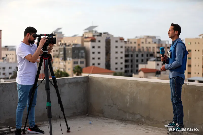 Palestinian journalists cover the conflict between Islamic Jihad movement and Israel in Gaza city on May 2023. Calm returned to Gaza as a fragile ceasefire ending five days of fighting held, leaving Palestinians and Isra...