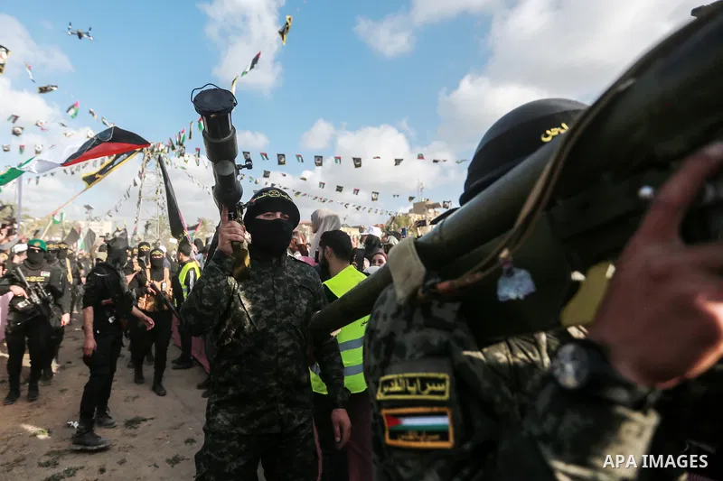 Supporters of the Islamic Jihad and armed men take part in a rally to commemorate the group's commanders and operatives killed by Israel in the recent cross-border conflict, in Gaza City on May 19, 2023. Tens of people w...