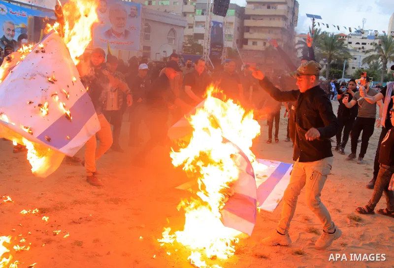 Supporters of the Islamic Jihad and armed men take part in a rally to commemorate the group's commanders and operatives killed by Israel in the recent cross-border conflict, in Gaza City on May 19, 2023. Tens of people w...