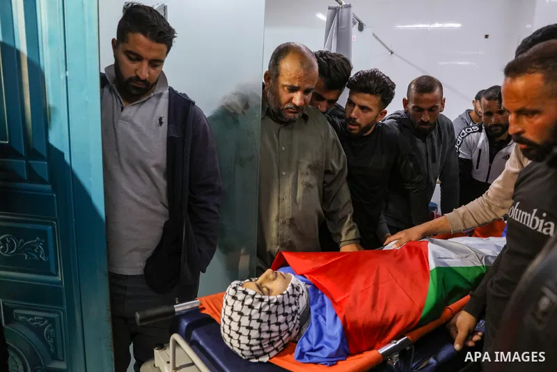 Relatives of Palestinians teenager Mustafa Amer Sabah who was shot killed by Israeli forces during clashes, mourn over his body at a hospital, in the West Bank city of Bethlehem on April 28, 2023. A sixteen-year-old Pale...