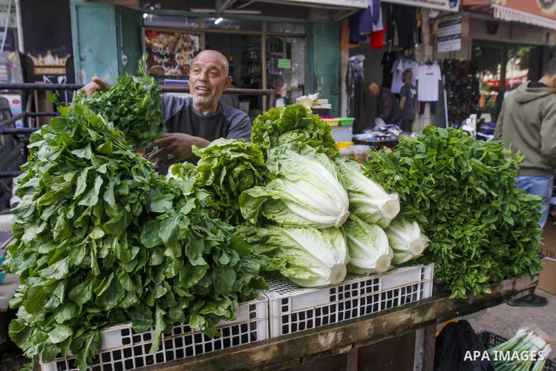 Palestinians shop at a market ahead of Eid al-Fitr which marks the end of the holy fasting month of Ramadan, in the West Bank city of Nablus on April 20, 2023. Eid Al Fitr 2023 is expected to fall on Friday, April 21, ma...