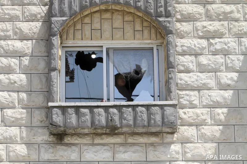 Palestinian homes that were damaged as a result of an attack by Jewish settlers in the town of Kufl Haris, east of Salfit, in the West Bank on April 17, 2023. Israeli settlers last night went on a rampage in the northern...