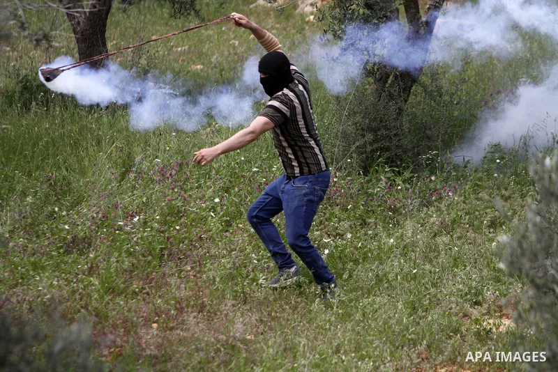 Clashes between Palestinian protesters and Israeli soldiers during a protest in the village of Beita, south of Nablus in the occupied West Bank, on April 10, 2023, against a march by settlers to the nearby Israeli outpos...
