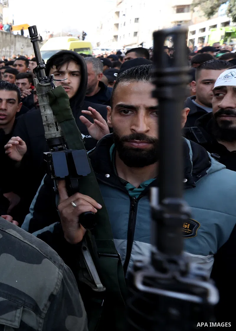 Mourners carry the body Palestinian Abdelfattah Kharwasheh, 49, who according to Israel, killed two Israeli settlers in a shooting attack, after he was killed by Israeli forces in a raid, during his funeral in Askar refu...