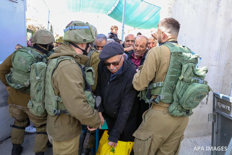 Palestinian Muslim worshippers heading to Jerusalem's Al-Aqsa Mosque compound to attend the second Friday noon prayer of the holy month of Ramadan, wait to cross an Israeli held checkpoint in Bethlehem, in the West Bank...