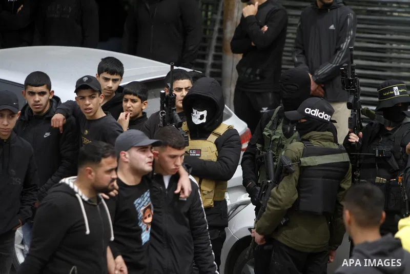 Palestinian mourners attend the funeral of Palestinian Amir Imad Abu Khadija, who was killed in an Israeli raid in Tulkarm in the West Bank on March 23, 2023. Israeli forces shot dead the Palestinian man, the Palestinian...