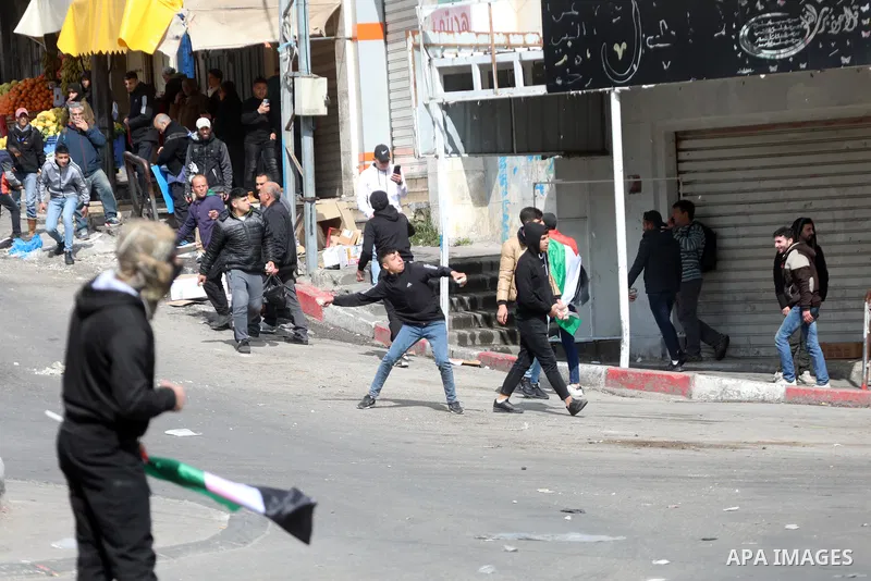 Palestinian protesters clash with Israeli forces following a protest against the presence of Israeli settlers in Hebron and to commemorate the 1994 Ibrahimi Mosque massacre, in the centre of the West Bank town on Feb. 24...