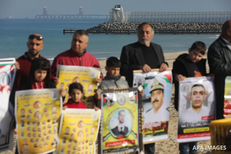 Palestinians take part in racing Pigeon sport as supporting of prisoner in Israeli jails on a beach along the Gaza sea barrier on the border with Israel near Kibbutz Zikim, north of Beit Lahia in the northern Gaza Strip...