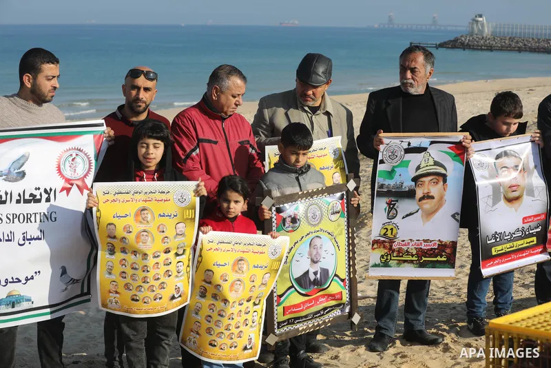 Palestinians take part in racing Pigeon sport as supporting of prisoner in Israeli jails on a beach along the Gaza sea barrier on the border with Israel near Kibbutz Zikim, north of Beit Lahia in the northern Gaza Strip...