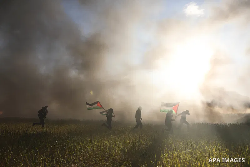 Palestinians burn tires during a protest against the killing of 10 Palestinians during an Israeli raid in Nablus near the fence with Israel east of Gaza city on Feb. 22, 2023. 10 Palestinians were killed and dozens shot...