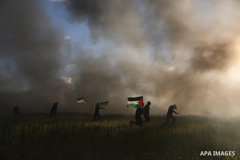 Palestinians burn tires during a protest against the killing of 10 Palestinians during an Israeli raid in Nablus near the fence with Israel east of Gaza city on Feb. 22, 2023. 10 Palestinians were killed and dozens shot...