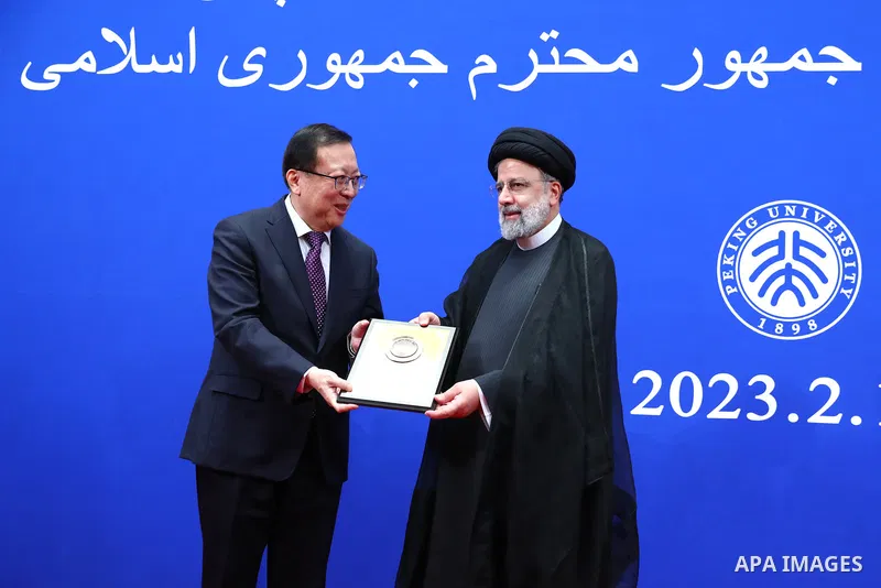 Iranian President Ebrahim Raisi awarding the title of honorary professor of Peking University in Beijing on Feb. 15, 2023. Photo by Iranian Presidency Office/APAimages