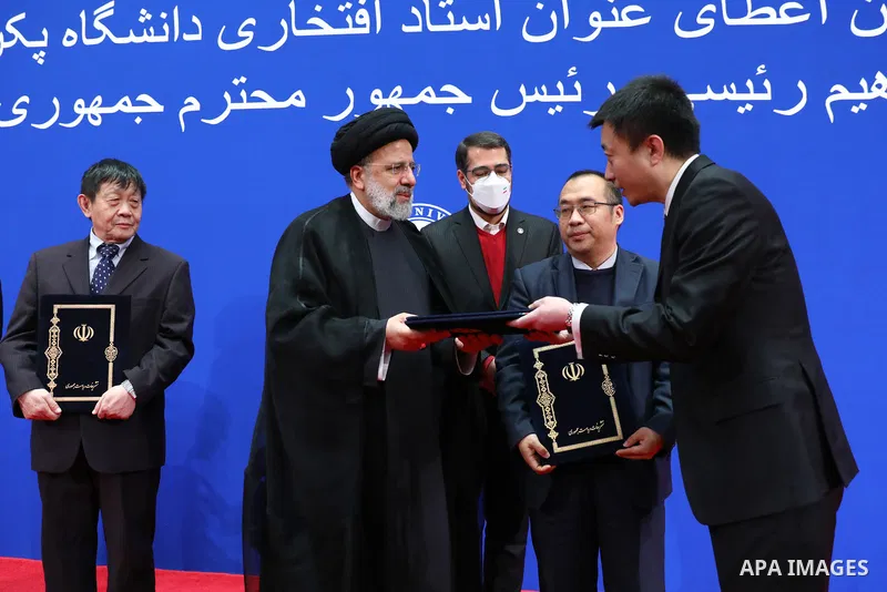 Iranian President Ebrahim Raisi awarding the title of honorary professor of Peking University in Beijing on Feb. 15, 2023. Photo by Iranian Presidency Office/APAimages