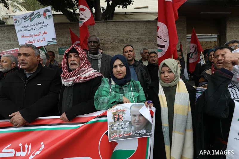 Palestinians take part in a protest in solidarity with prisoners in Israeli jails, in front of Red cross office, in Gaza city on Feb. 13, 2023. Nearly 7,000 Palestinians were arrested by the Israeli forces in the Palesti...