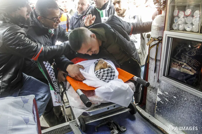 Mourners carry the body of Mithkal Suleiman Rayyan, 27, shot dead during a clash with Jewish settlers, during his funeral procession near the northern West Bank city of Nablus on Feb. 12, 2023. Rayyan, died of a bullet w...